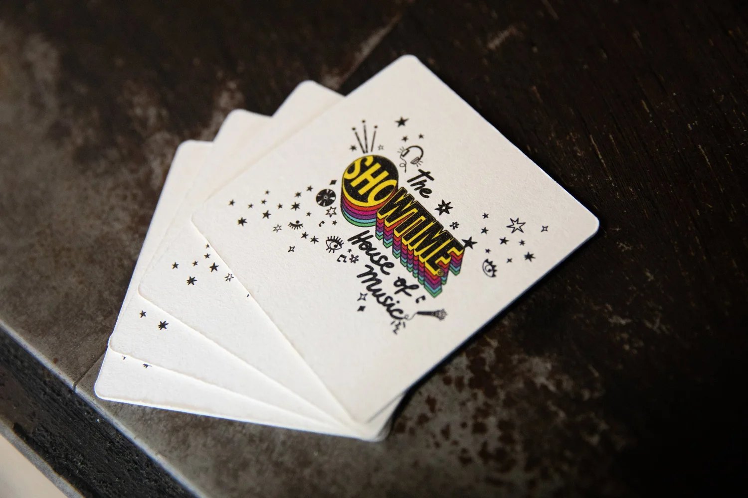 Playing cards. A system that survives being printed at two inches is a system